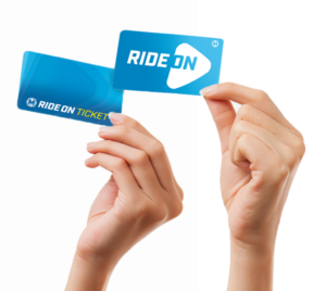 Hands holding new Ride On passes